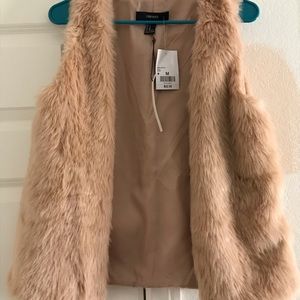 Pink faux fur vest. Brand new